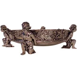 antique centerpiece with decorative figures and intricate design
