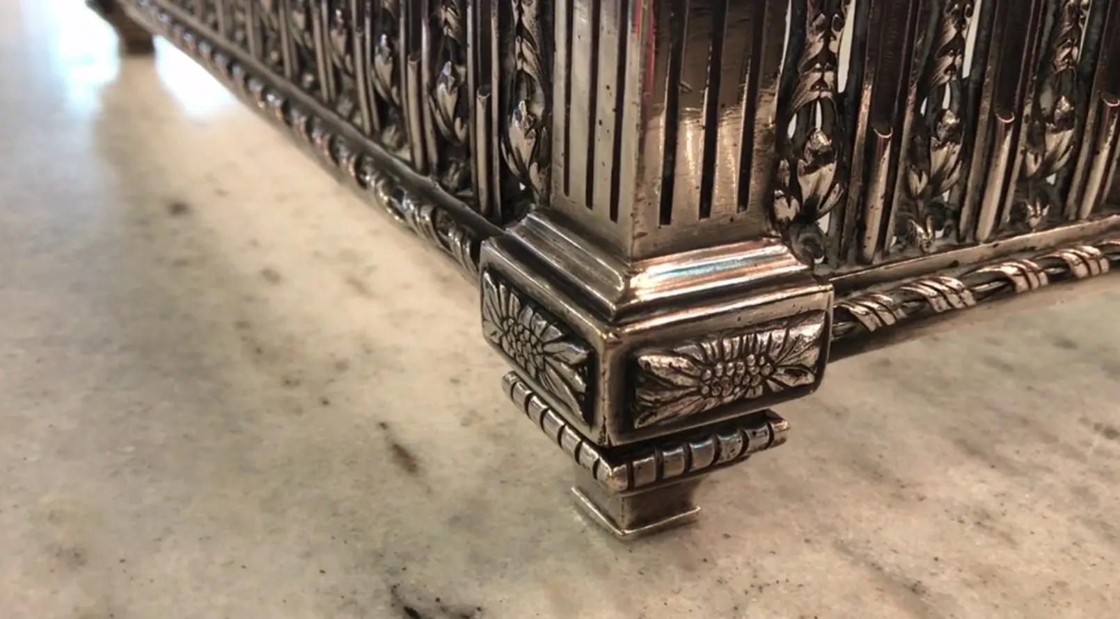 antique centerpiece with ornamental details on base