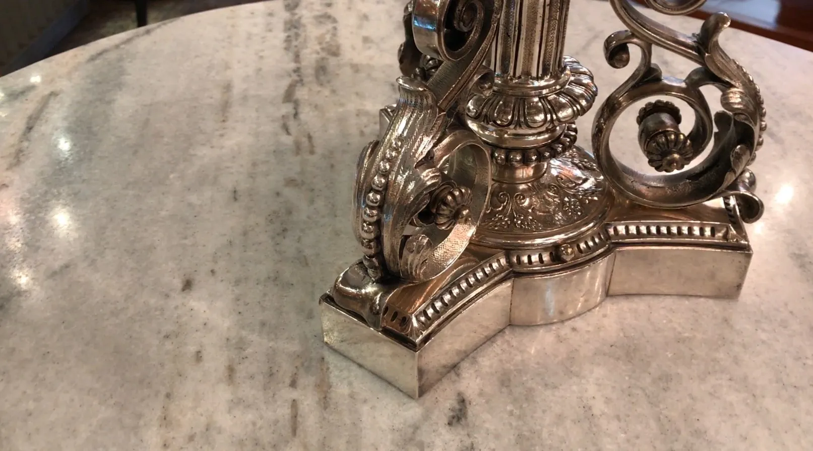 antique Christofle centerpiece on a light table, elegant design