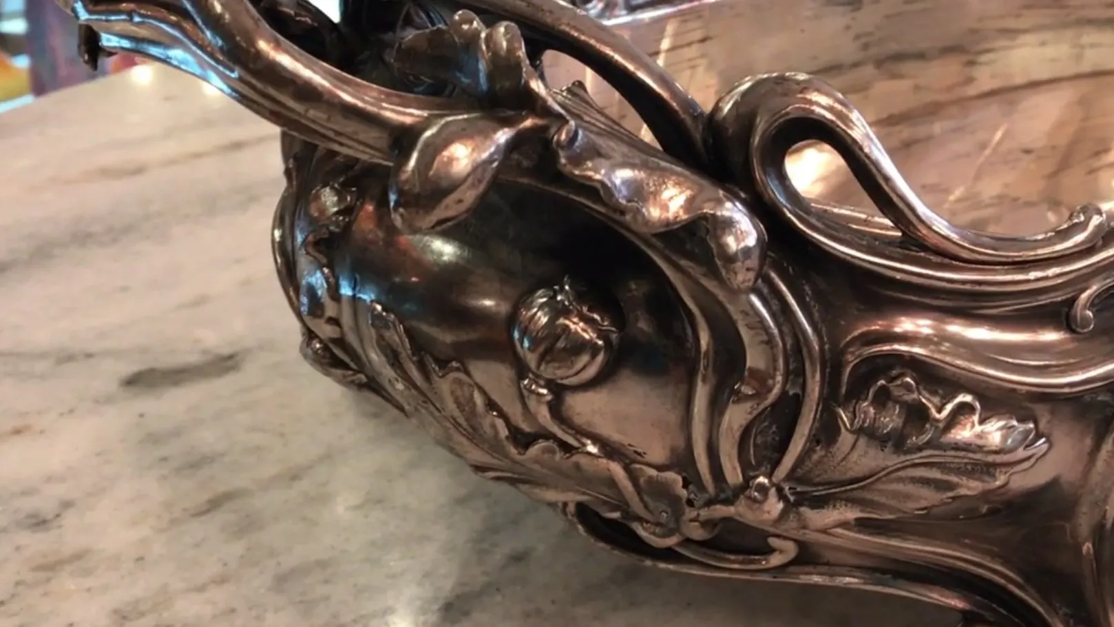 antique centerpiece adorned with leaves, elegant setting