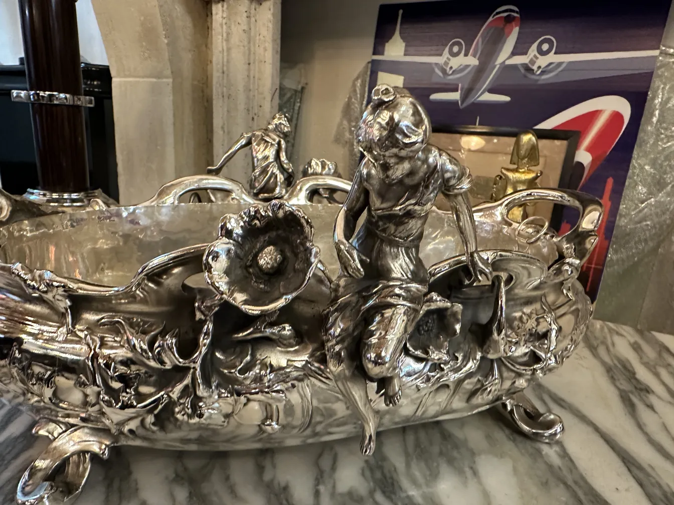 antique centerpiece decorated with figures and flowers