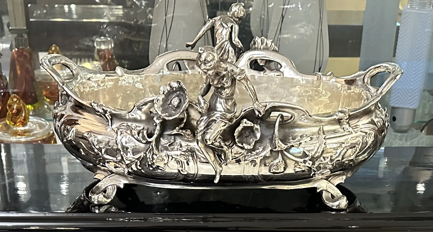 antique centerpiece with figures in an elegant display