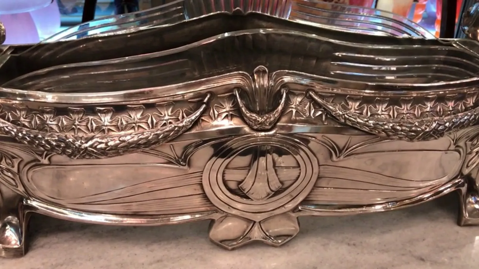 antique WMF centerpiece with elegant details and curved shapes in a classic setting