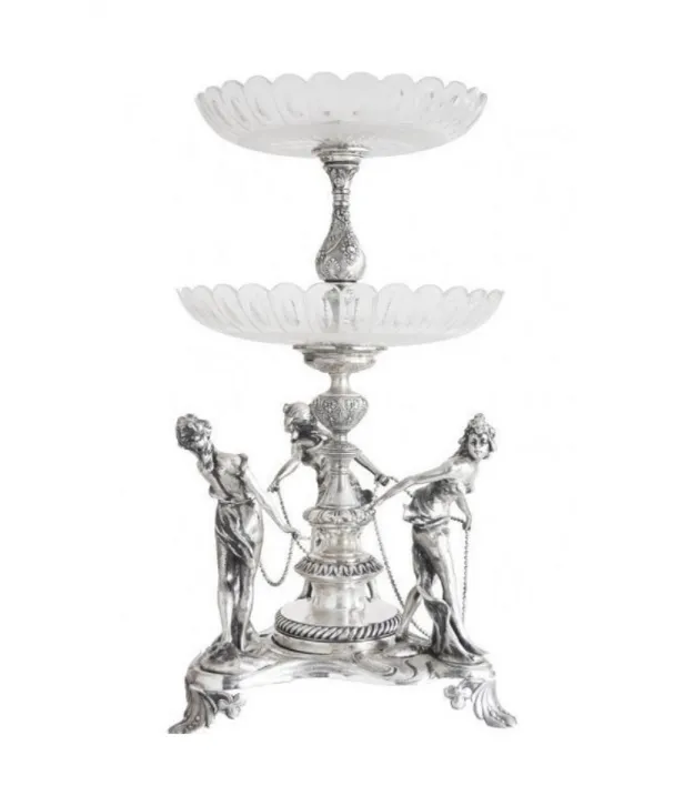 bellissimo centrotavola wmfi con figure decorative e due livelli.