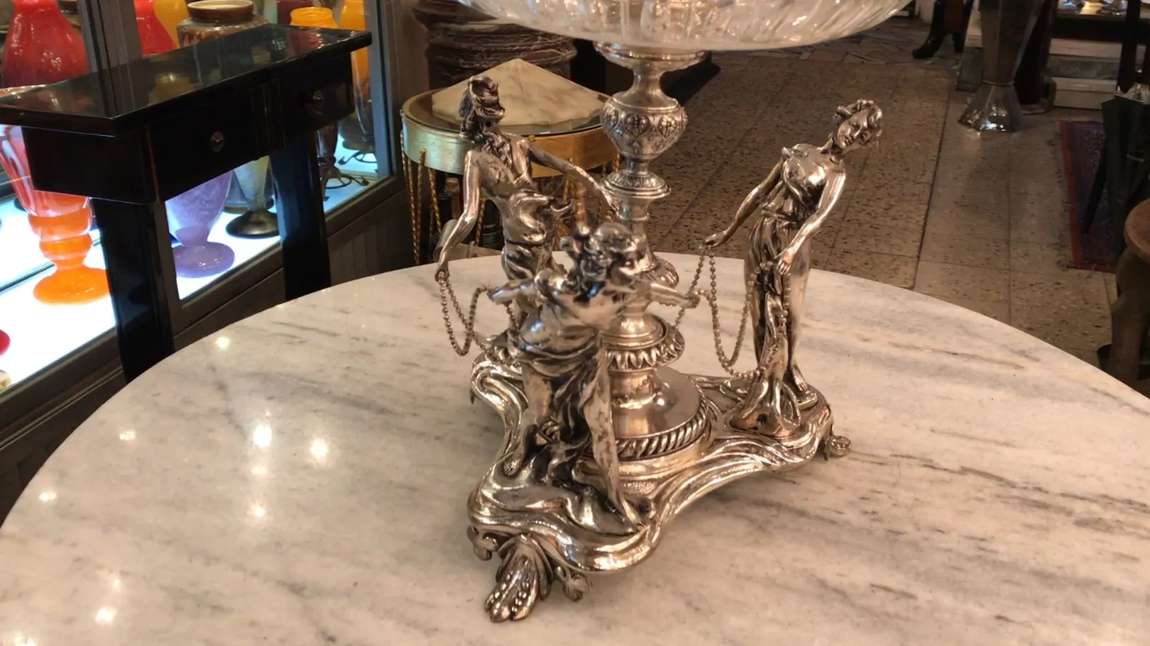 antique WMF centerpiece with decorative figures and a large bowl