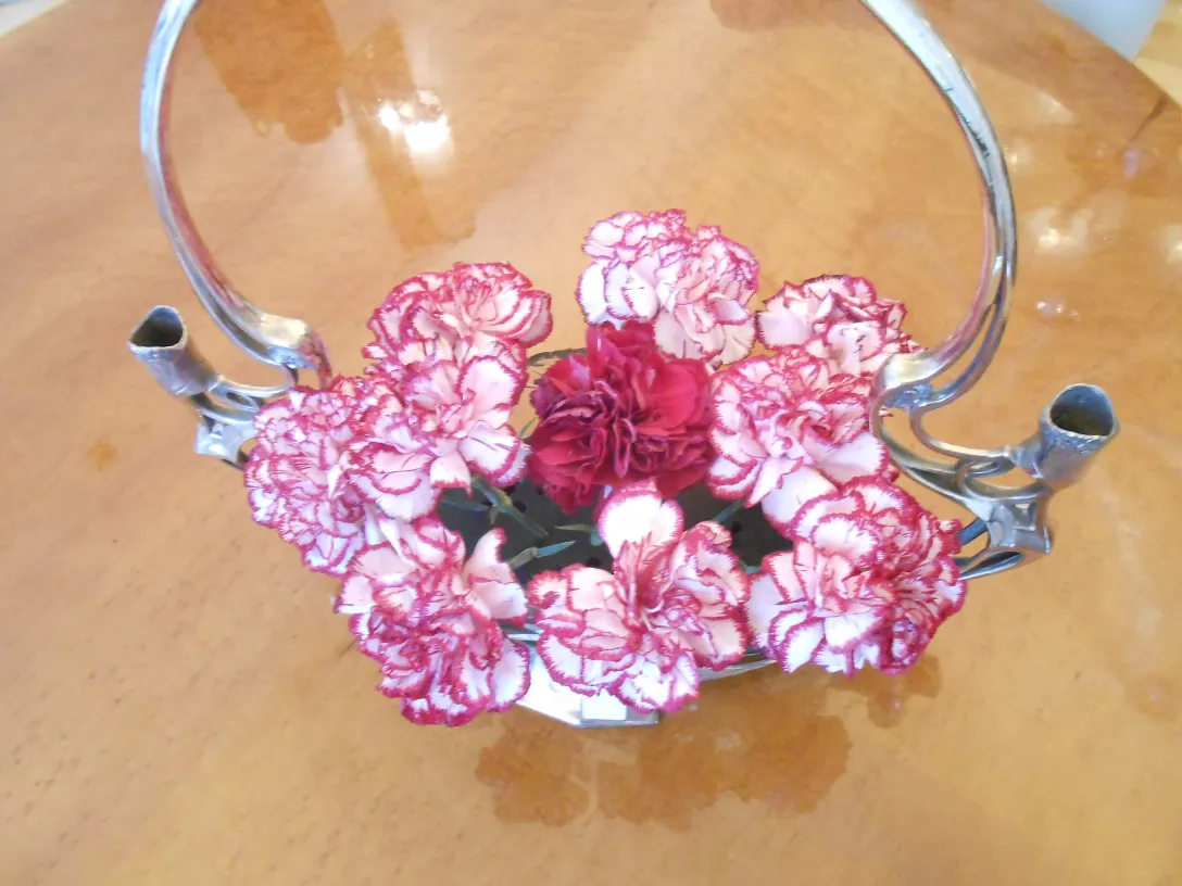 antique WMF centerpiece with red carnations