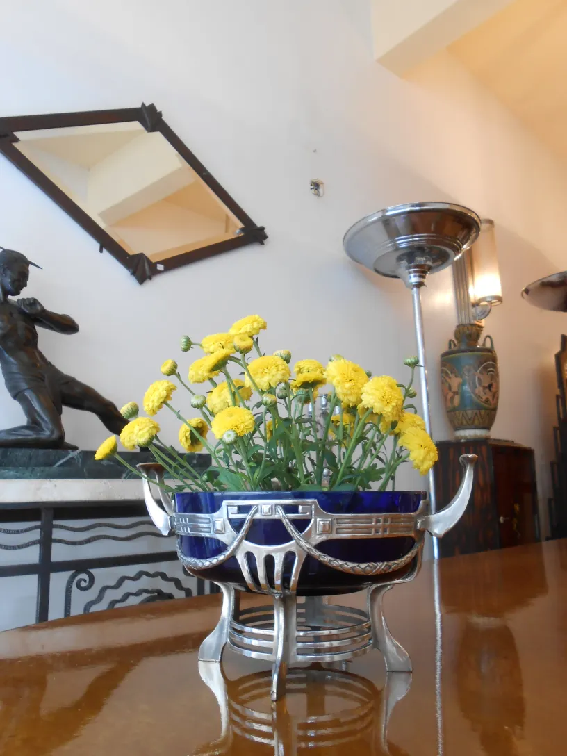 wmF antique centerpiece with yellow flowers in a stylish setting