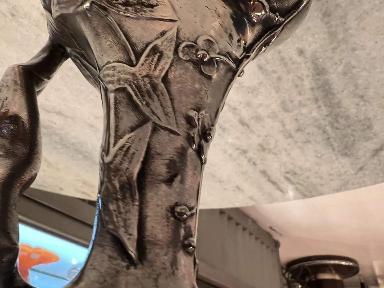 antique jar with floral decorations on the body