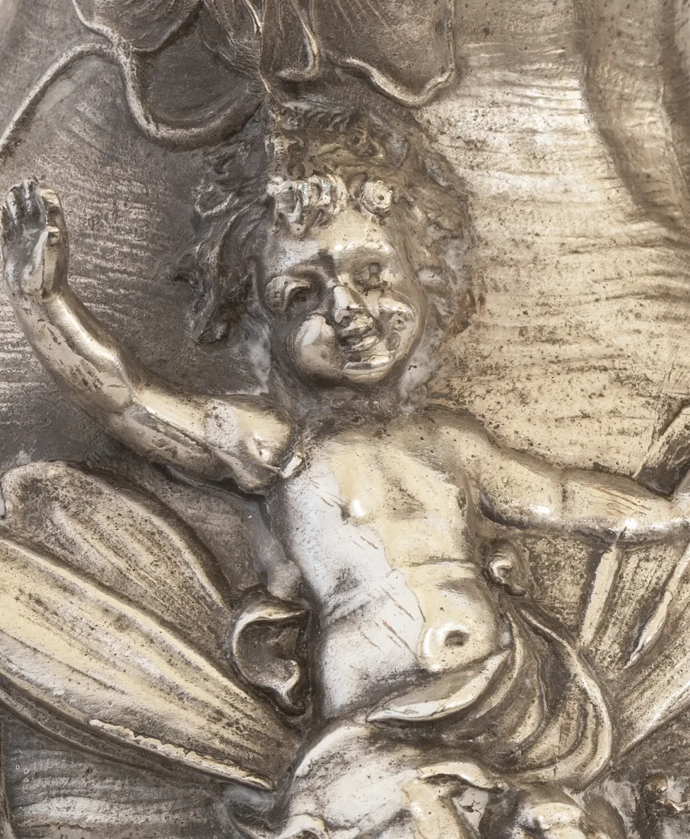 ancient jar with a smiling child and floral details