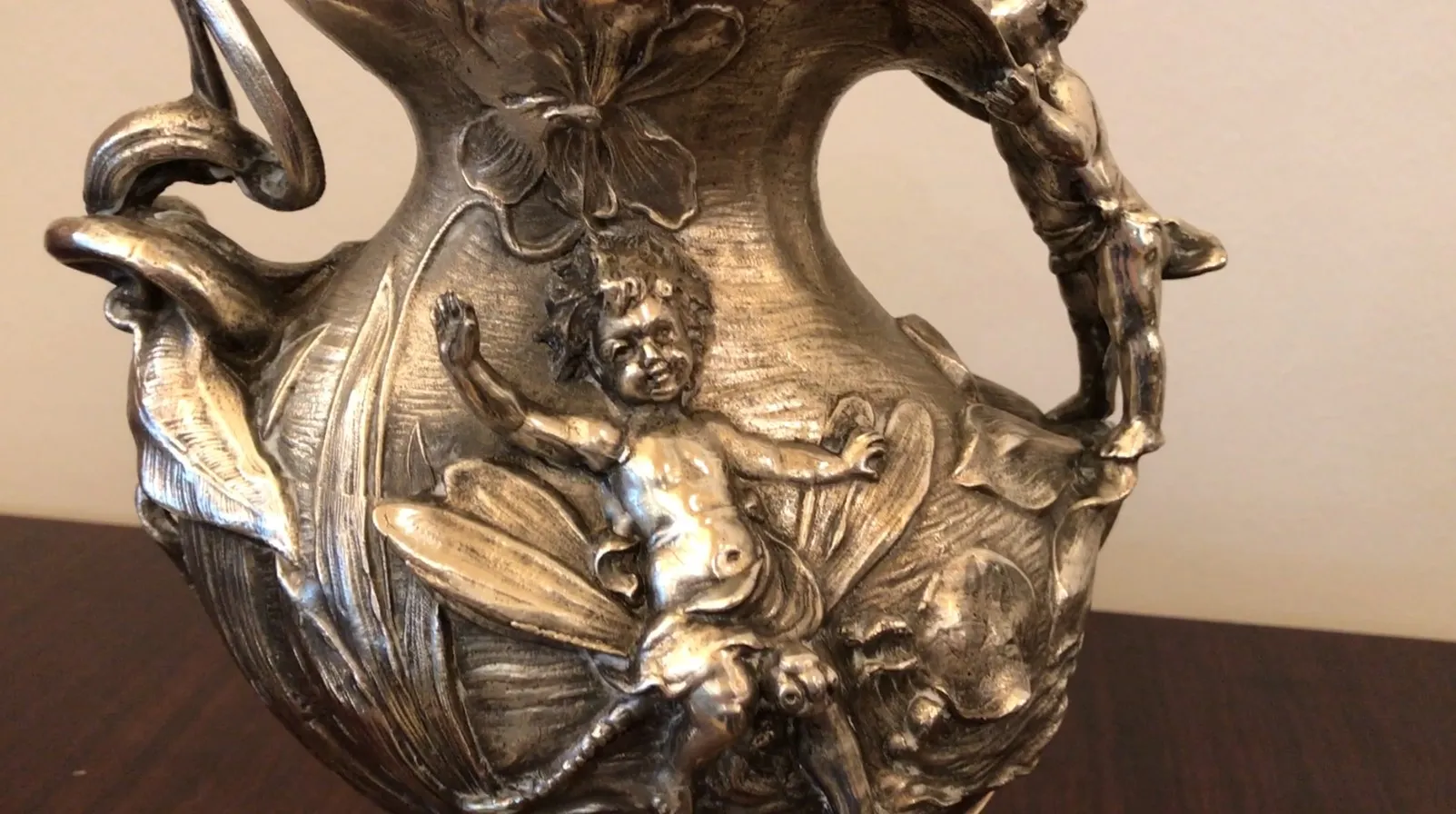 Antique decorative jar with figures and flowers, elegant setting