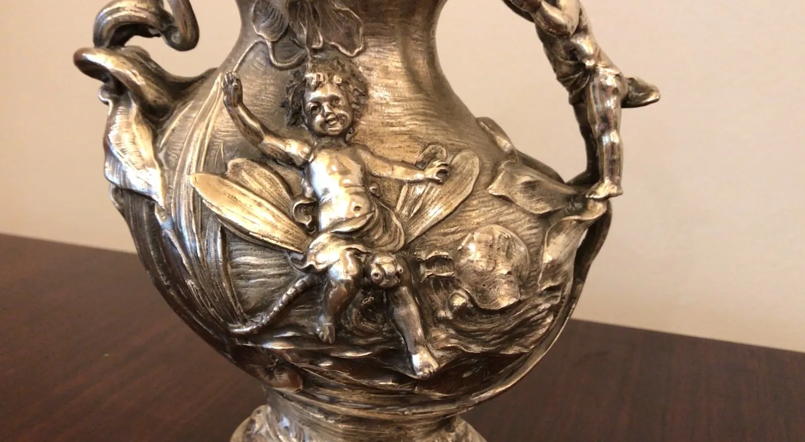 antique jar with relief and figures in its design