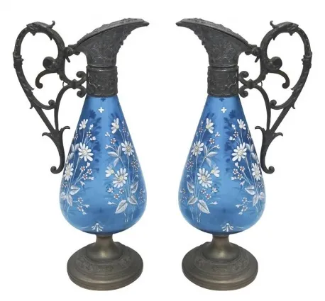 two antique blue jars with floral decorations in a cozy setting