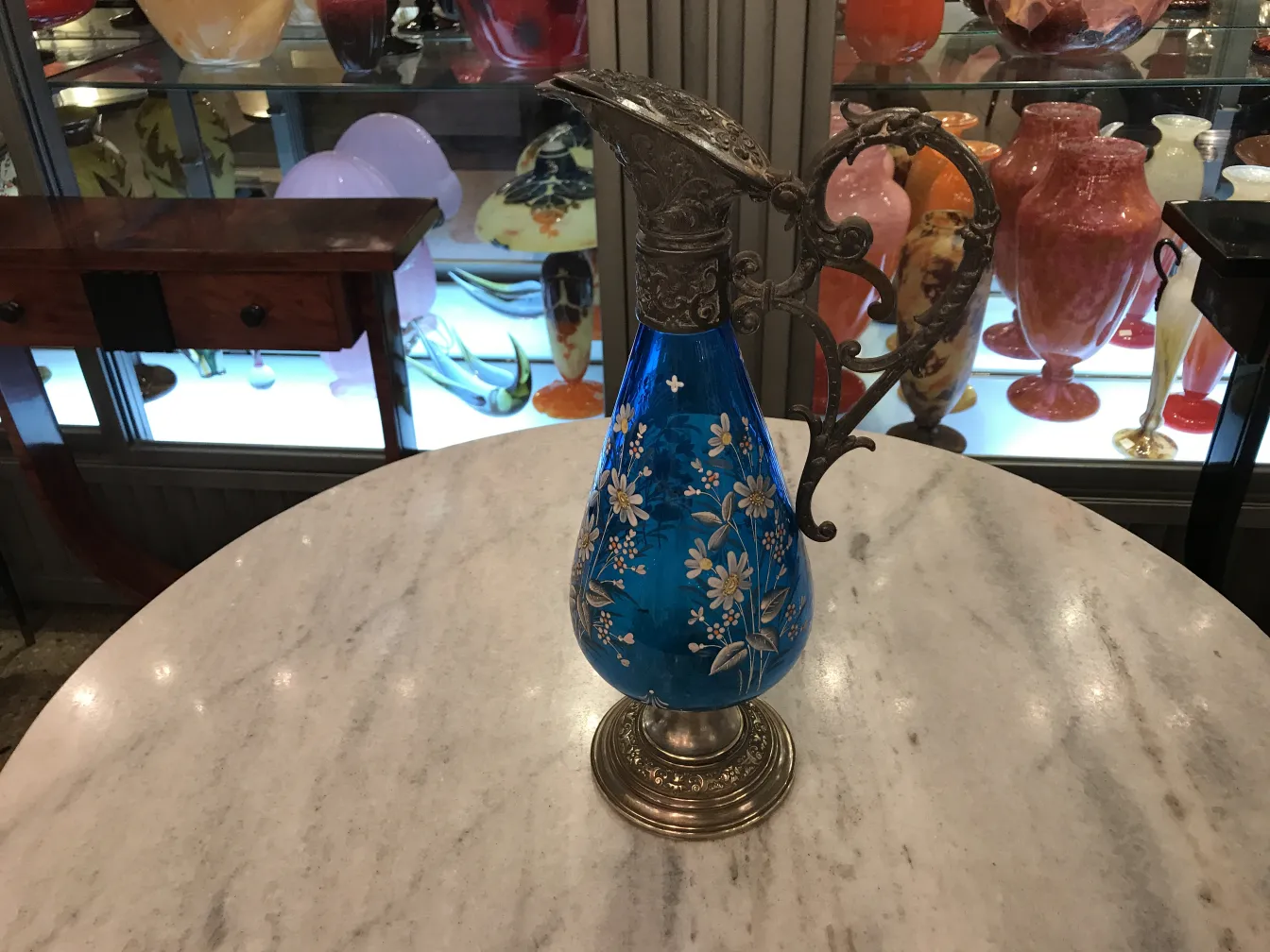 Two antique WMF jars with blue design and flowers, decorative in an elegant setting