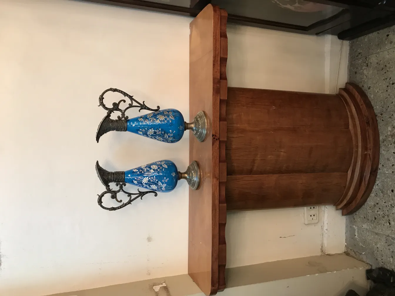 two blue antique wmf jars on a table