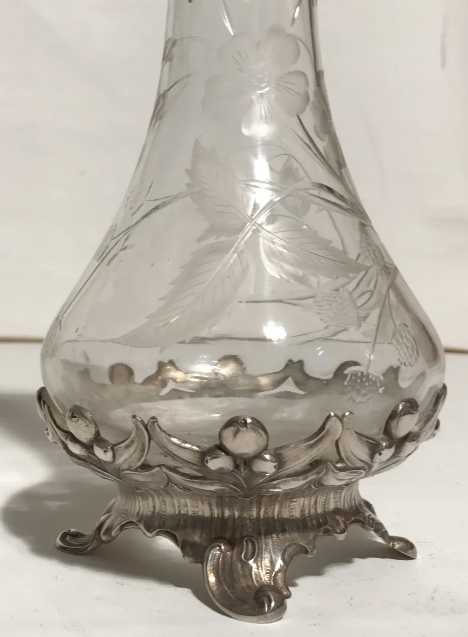 2 antique WMF jars with floral engravings at the base.