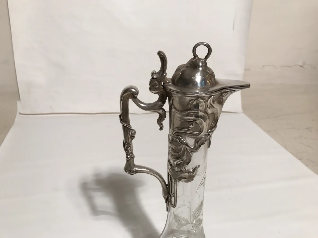 Set of 2 antique WMF jars featuring intricate design, ornamentation on the handle.