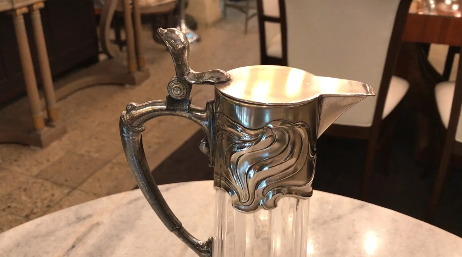 two antique WMF jars with elegant design on a table