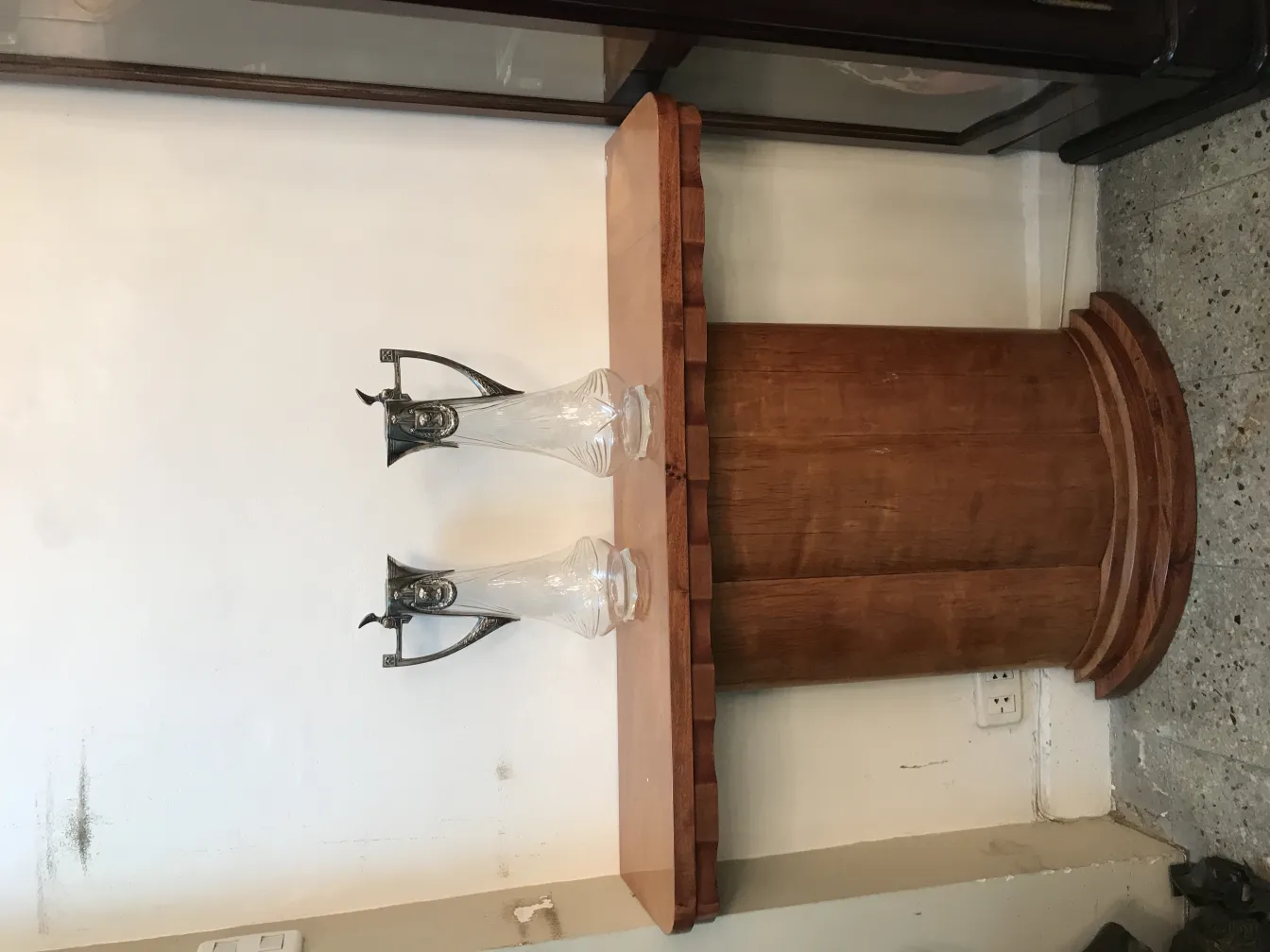 View of two antique WMF jars made of glass on a table, neutral background.