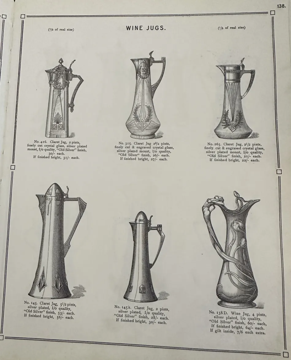 Due brocche antiche WMF con dettagli decorativi intricati, su sfondo neutro.