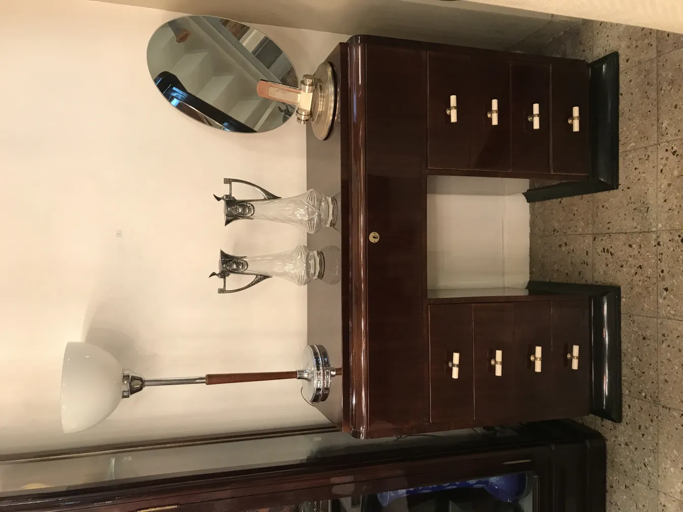 Antique wmfa jars on a table with a mirror