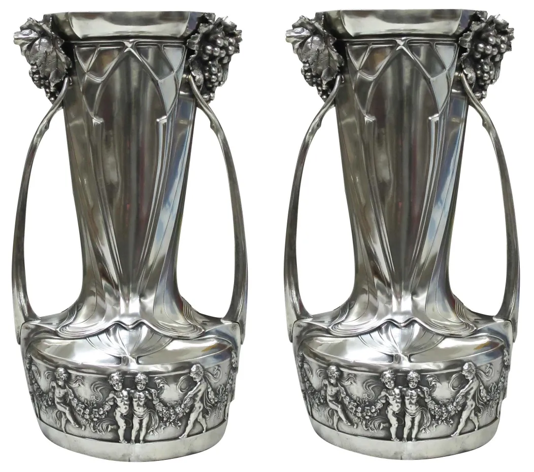 two vintage champagne coolers with floral decoration and figures