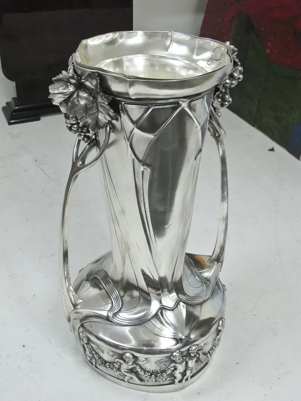 Antique WMF champagne coolers featuring intricate design and floral accents