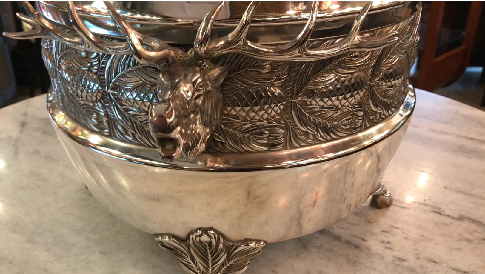 old WMF punch bowl featuring ornate deer and leaves