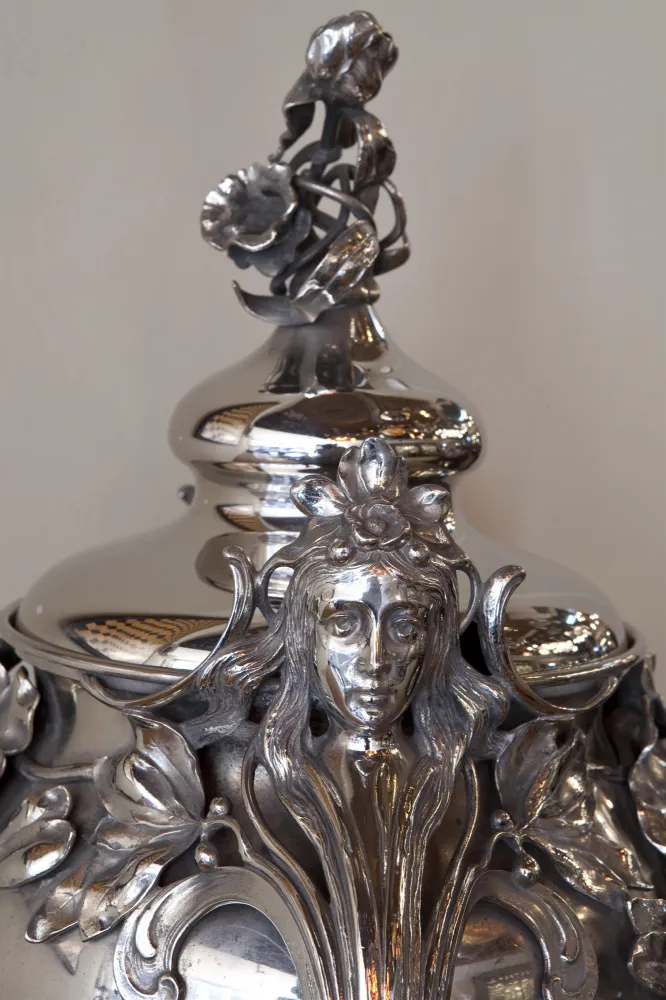 antique WMF punch bowl with intricate floral design and decorative lid