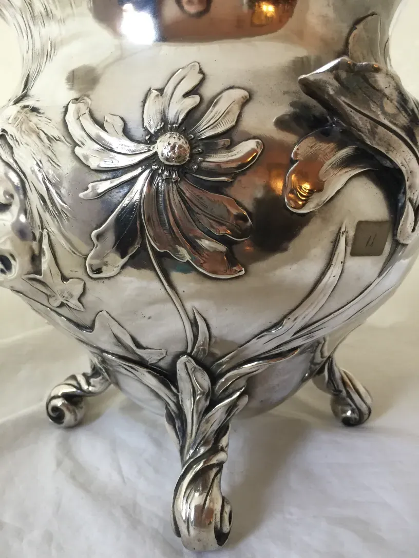 Antique WMF punch bowl with floral decorations on the surface