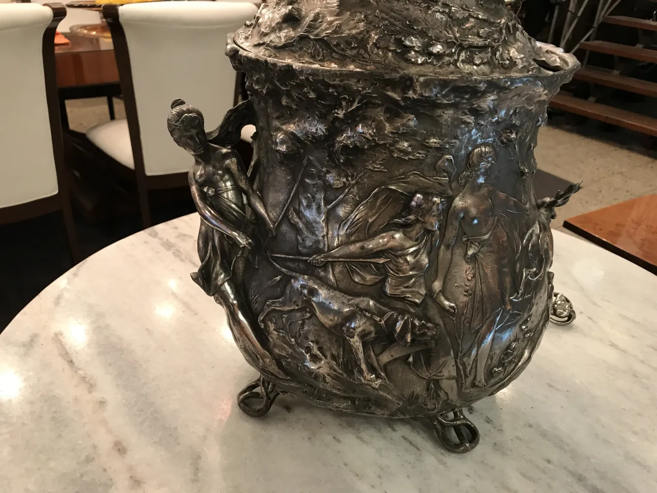 Antique WMF punch bowl with mythological scenes, detailed base.