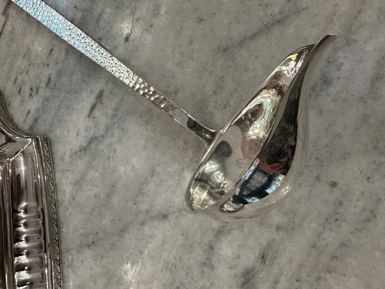 antique WMF punch bowl with ladle on marble surface