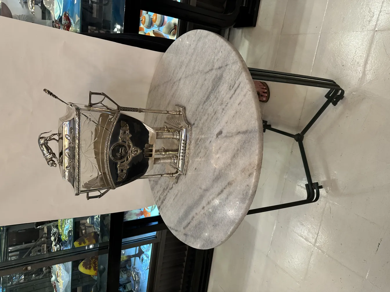 Antique WMF punch bowl with intricate design in a festive setting.