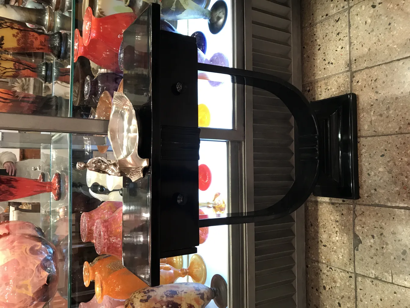 Antique card tray WMF with colorful vases in the background