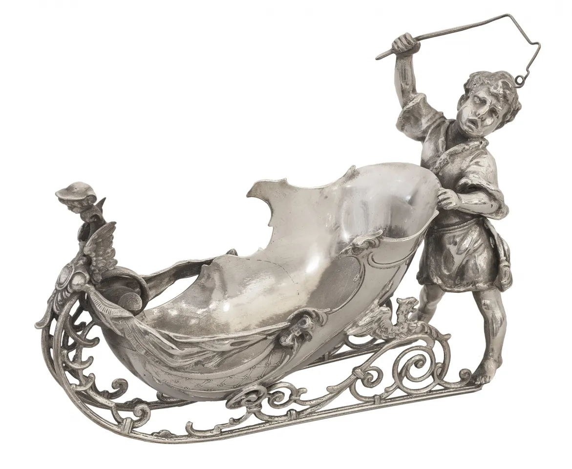 antique card tray featuring an ornate design and a boy figure