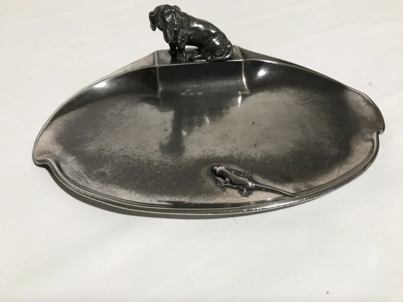 antique card tray featuring dog and salamander, detailed design