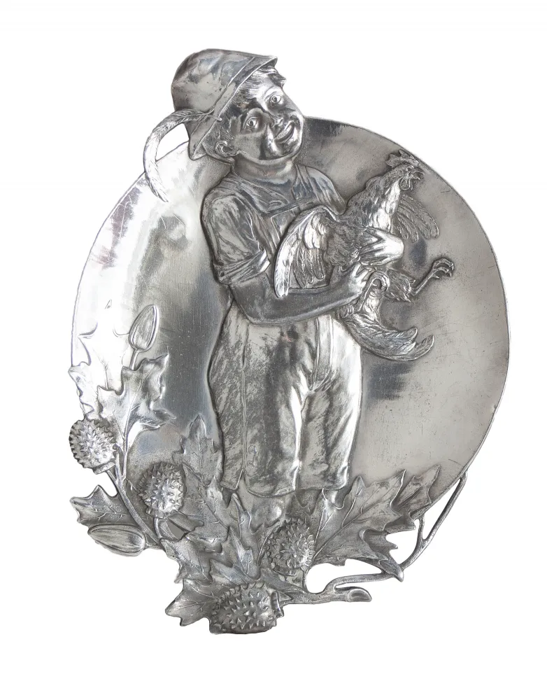 antique card tray WMF featuring a boy holding a rooster, surrounded by leaves