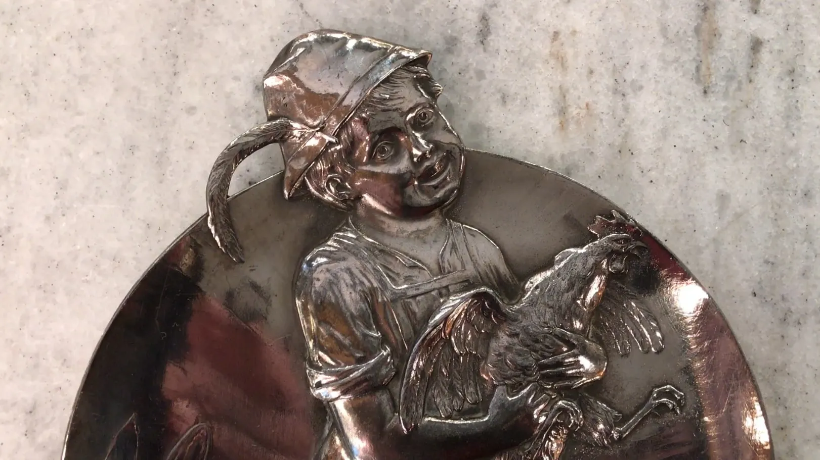 antique card tray featuring a child holding a rooster.