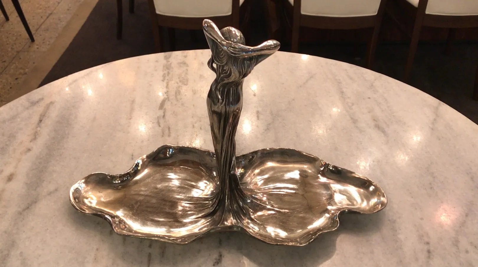 antique card tray with elegant design and central figure