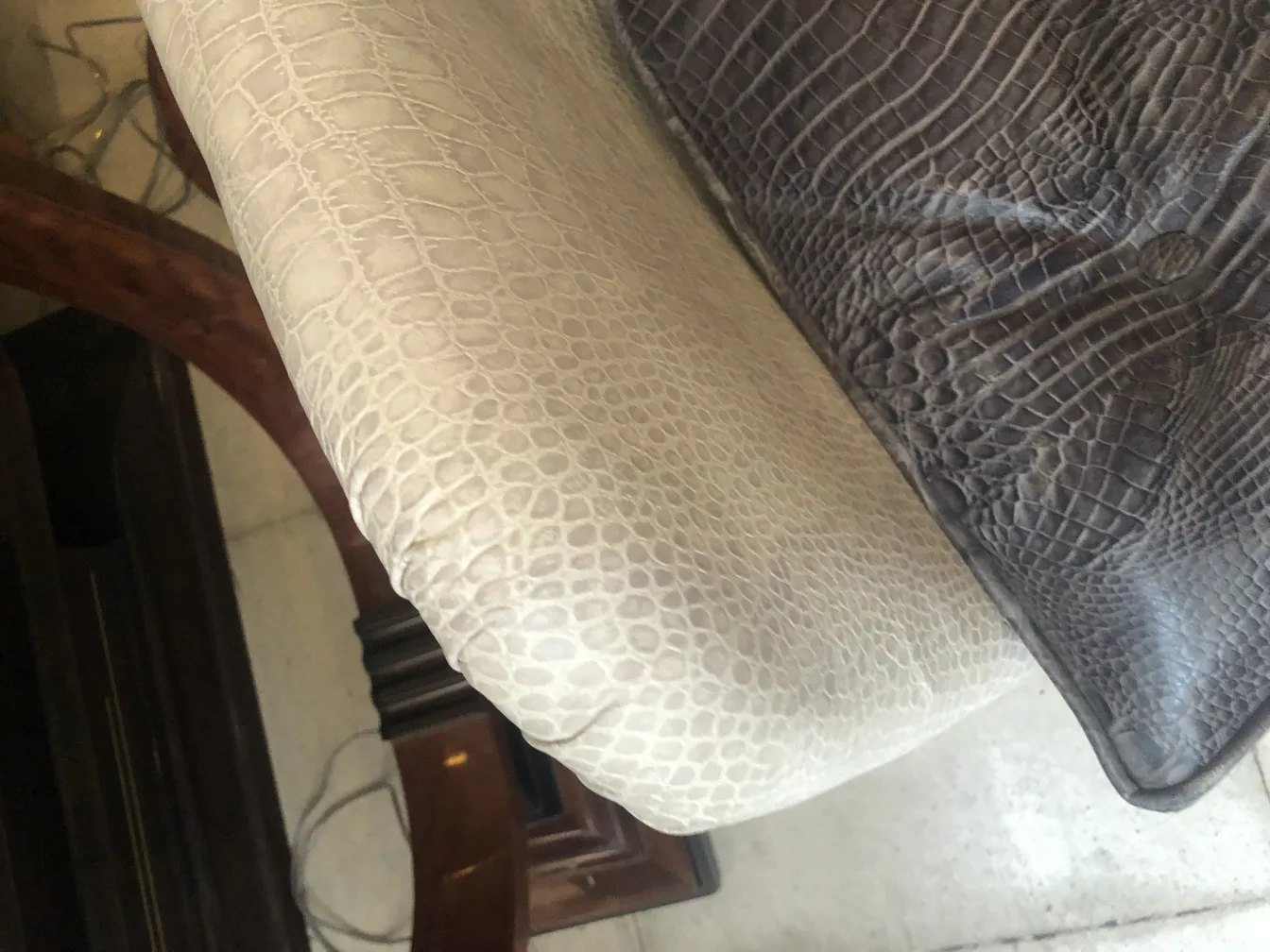 Antique armchair with a unique and elegant design, part of a cozy setting.