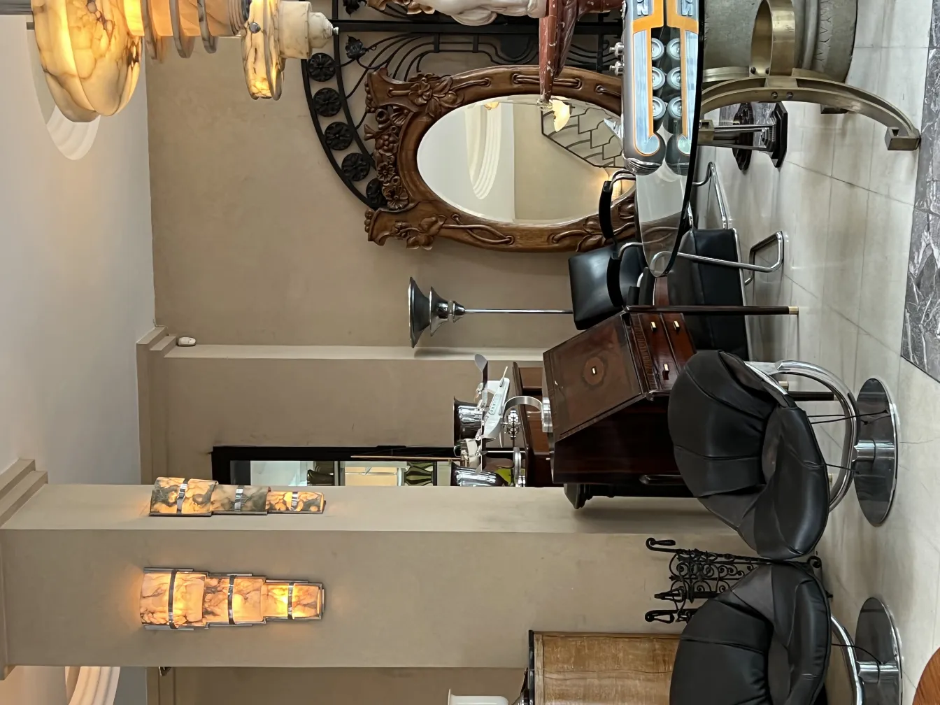 Two antique armchairs in an elegant setting with soft lighting.