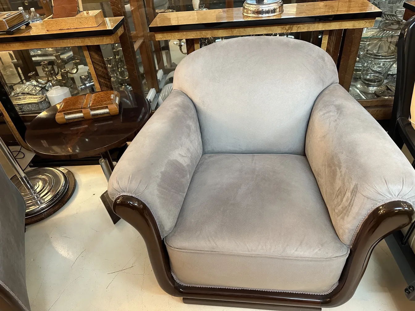 2 antique armchairs with soft upholstery in an elegant setting.