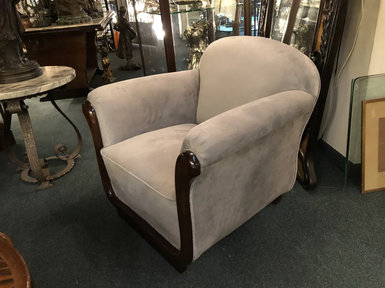 two antique comfortable armchairs in an antique setting