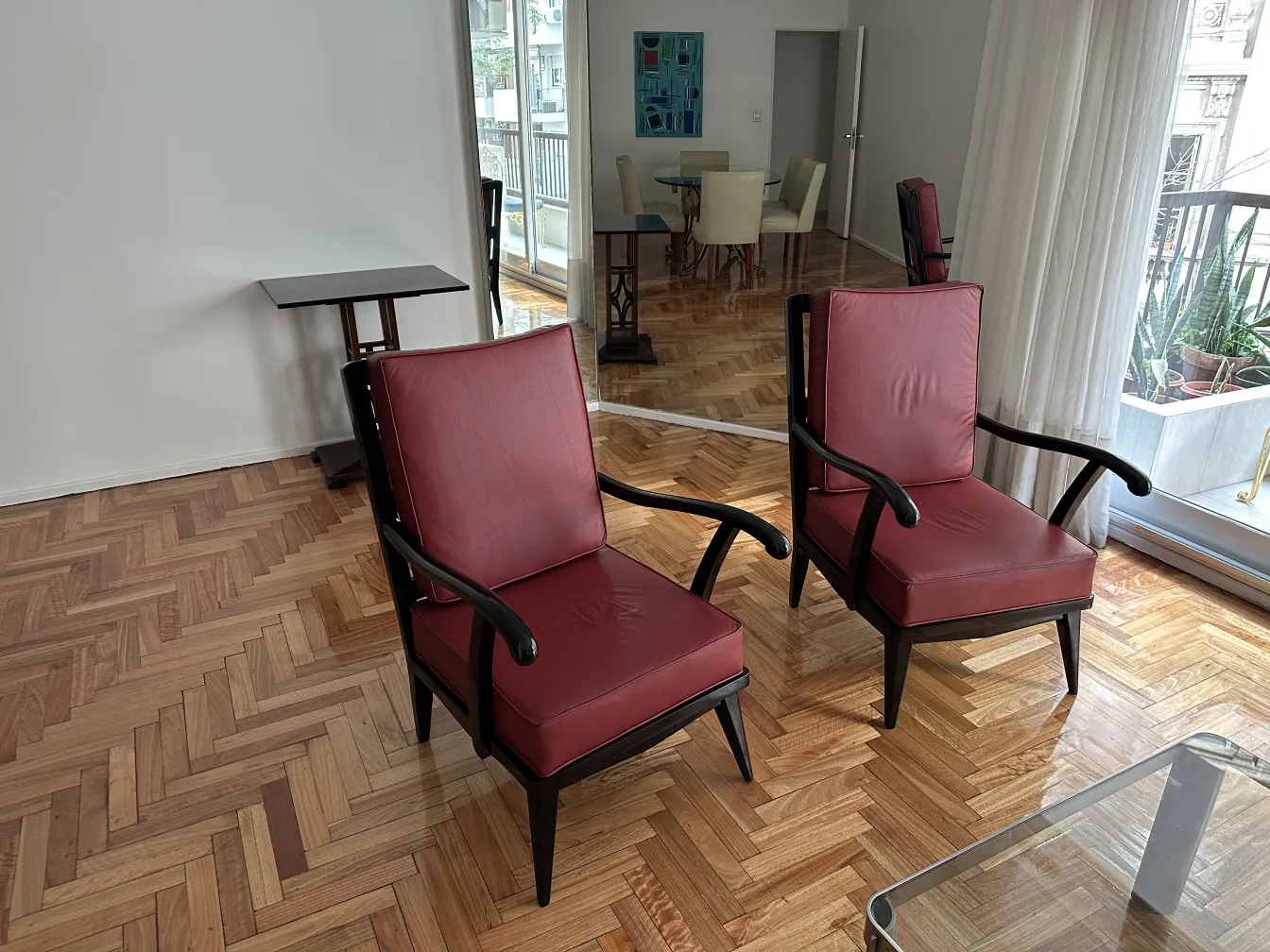 two antique red armchairs in an elegant setting