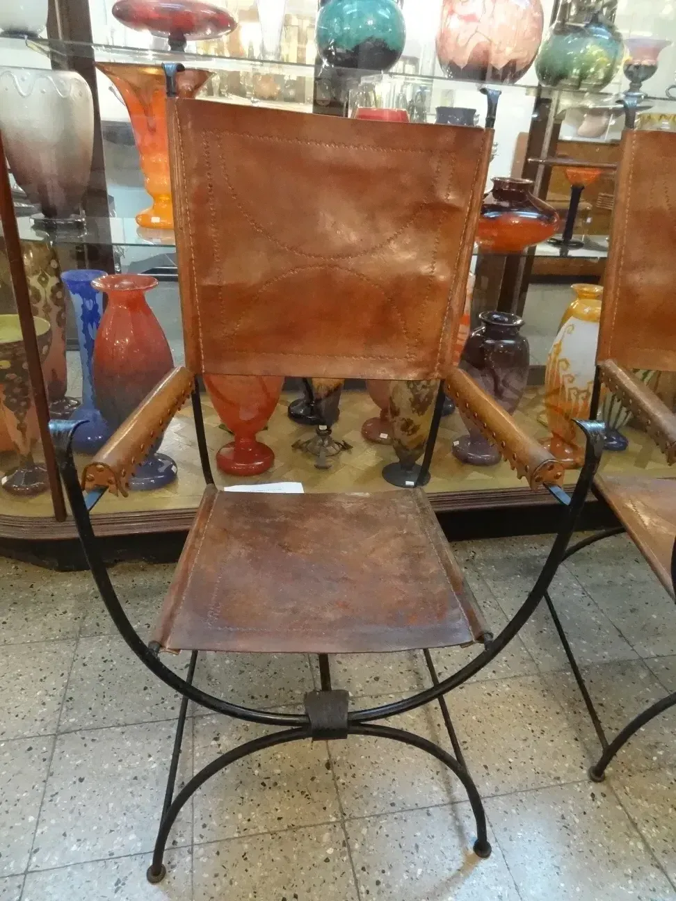 2 antique armchairs in a vibrant decorative setting