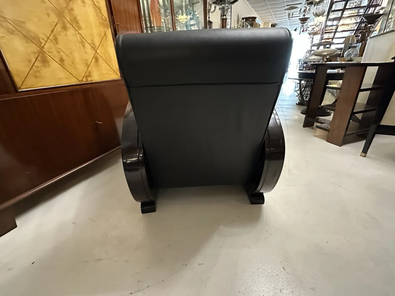 Rear view of 2 antique armchairs in an elegant setting