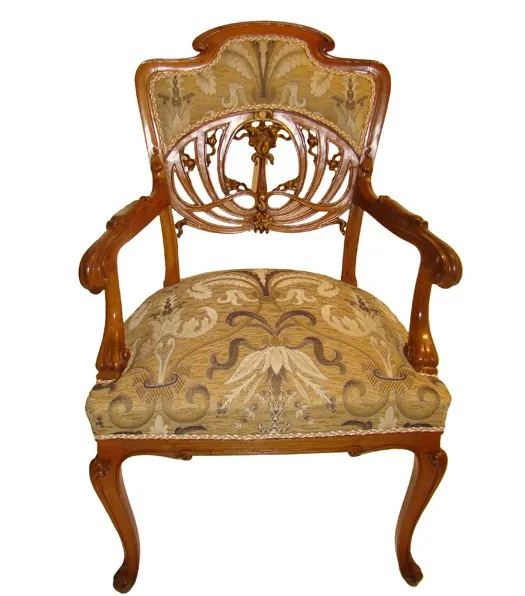 Three antique armchairs with detailed patterns on the seat and backrest