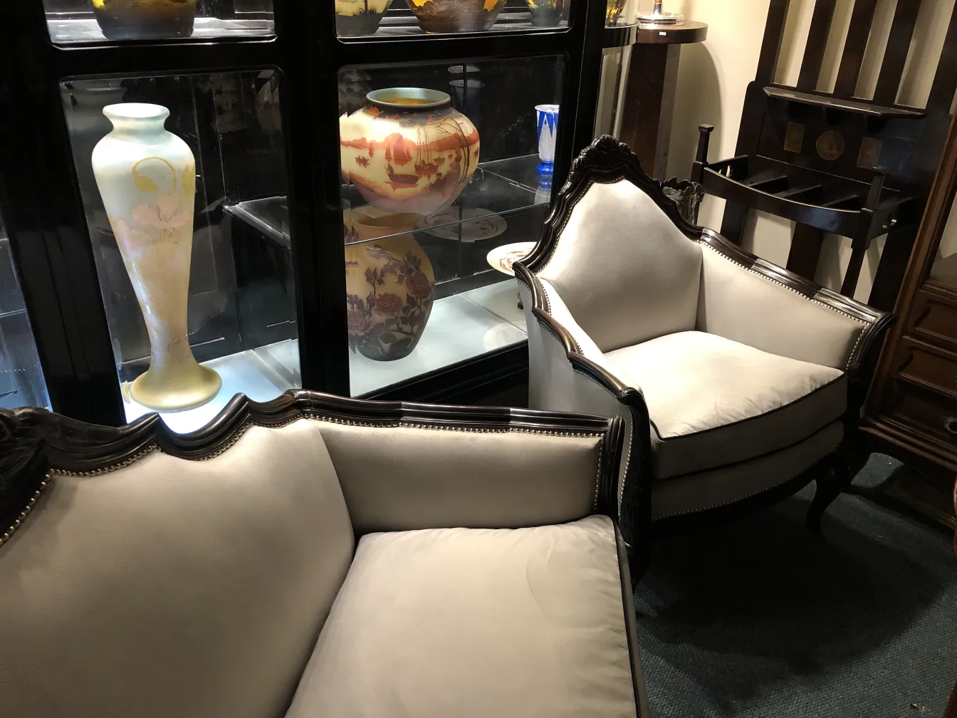 Three elegant antique armchairs in a cozy setting