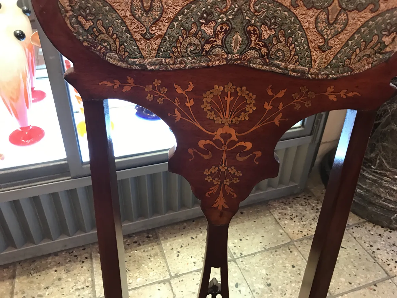 Three antique armchairs and four chairs, elegantly decorated.