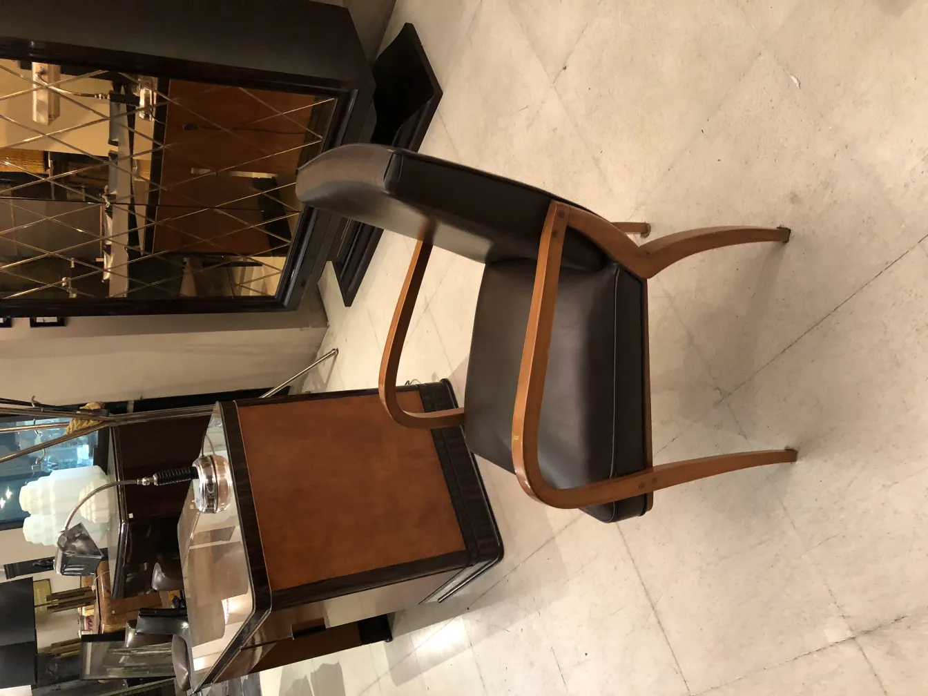 antique desk chair with a dark finish in an elegant setting