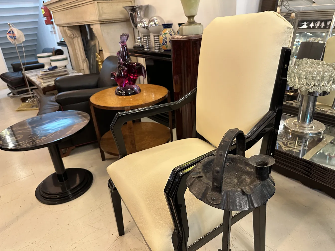 Antique desk chair with light upholstery, elegant setting.